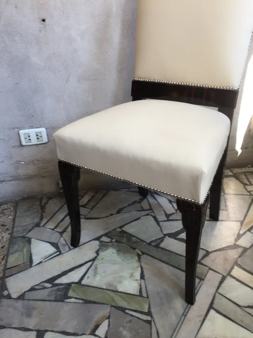 side view of 6 antique chairs in a modern setting