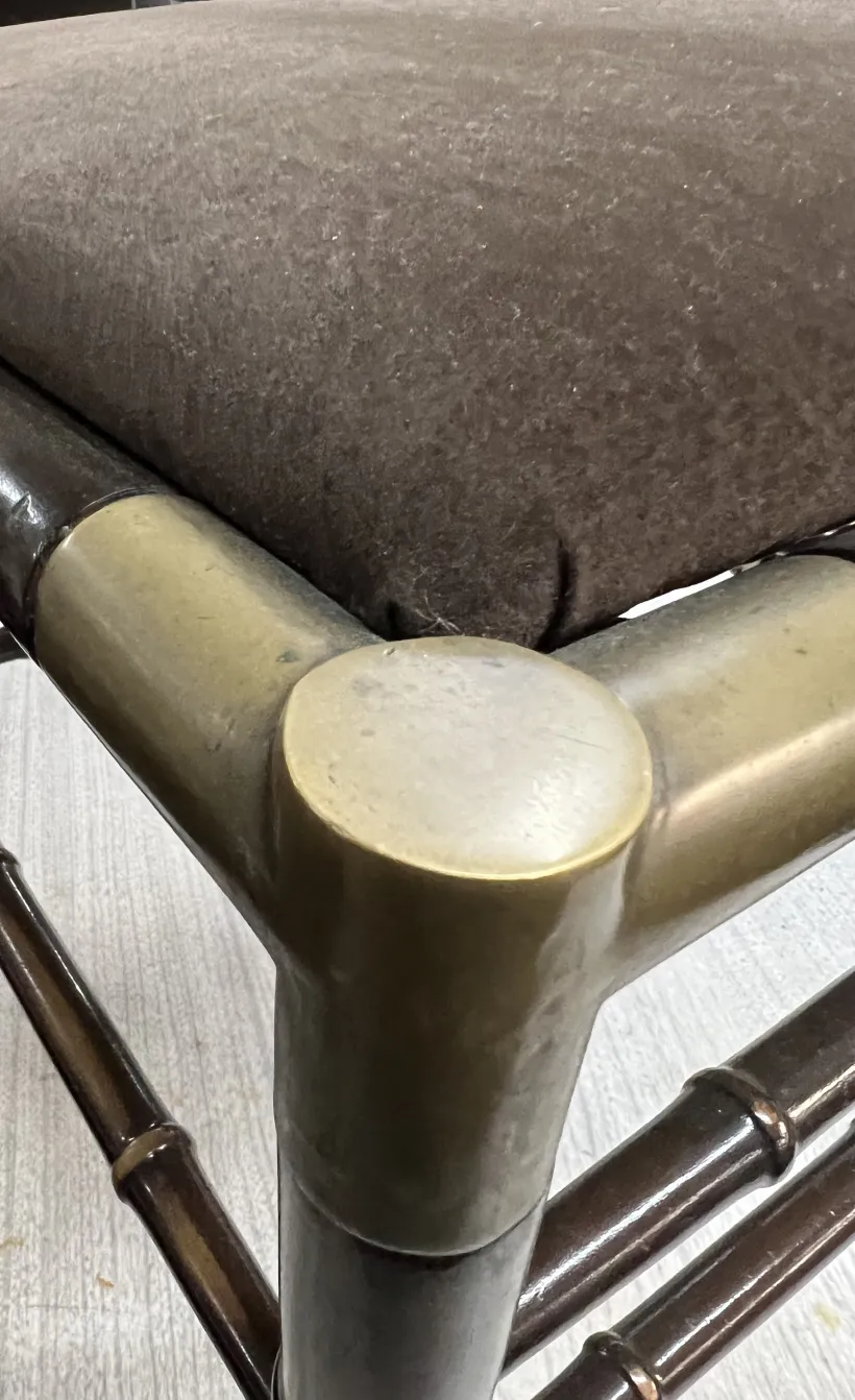 Close up of 6 antique chairs, elegant design details and structured legs in a neutral setting.