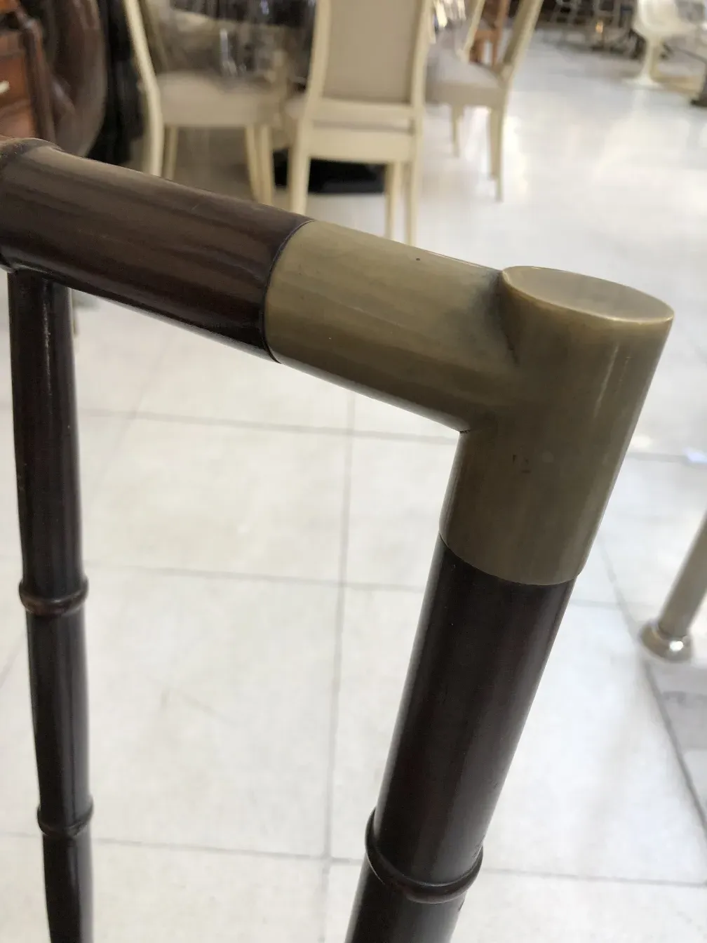 side view of an antique chair frame with decorative details