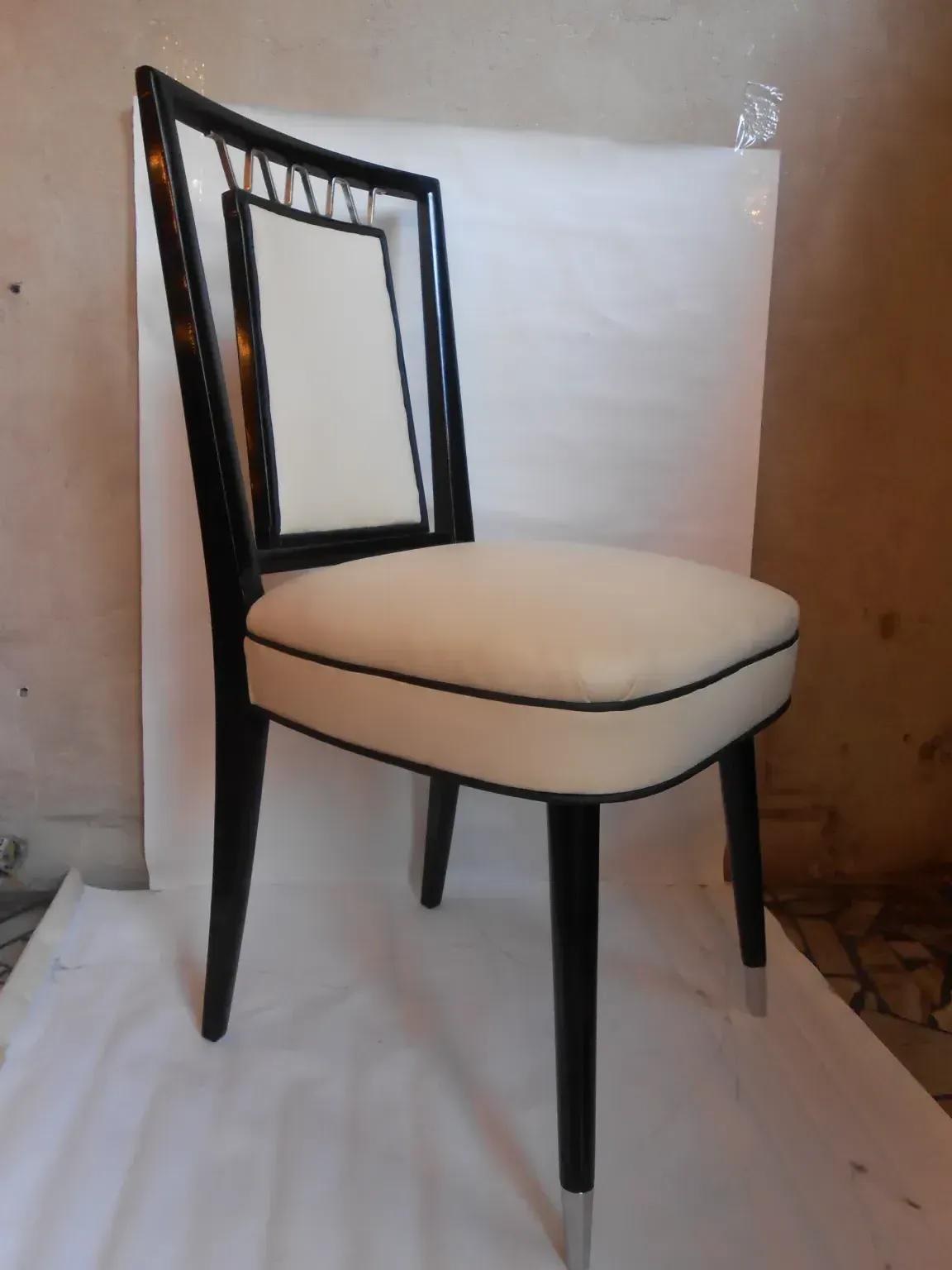 ten antique chairs in a simple setting