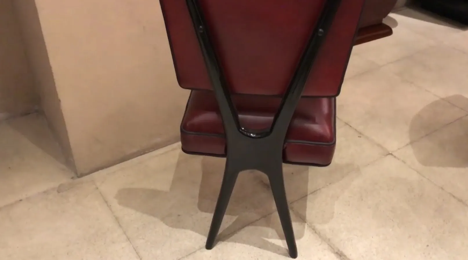 View of 12 vintage chairs in an elegant setting, red and black colors.