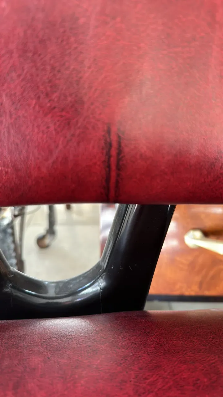 Close view of 12 antique chairs with decorative details