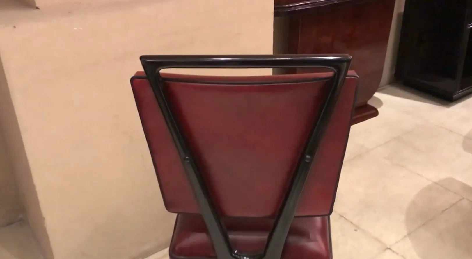 View of antique brown chairs in a classic setting