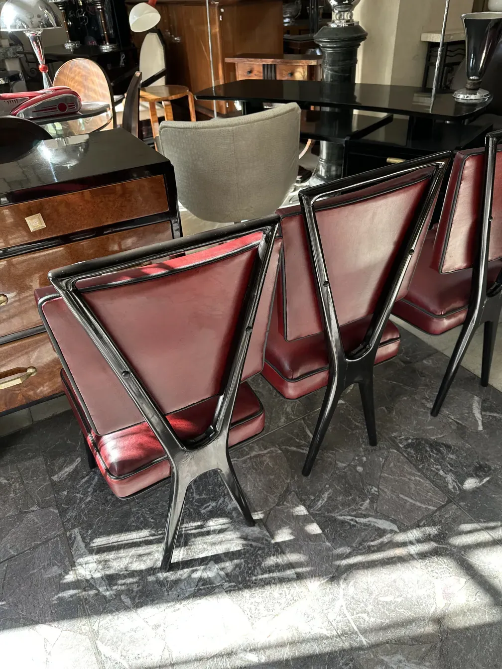 twelve antique chairs featuring elegant design in a classic setting