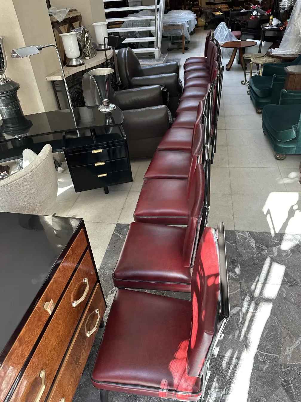 12 antique red chairs lined up in a cozy setting