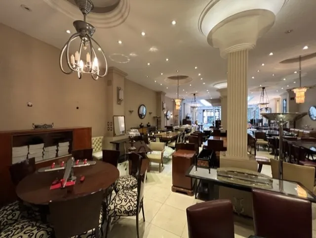 12 antique chairs in an elegant restaurant with soft lighting