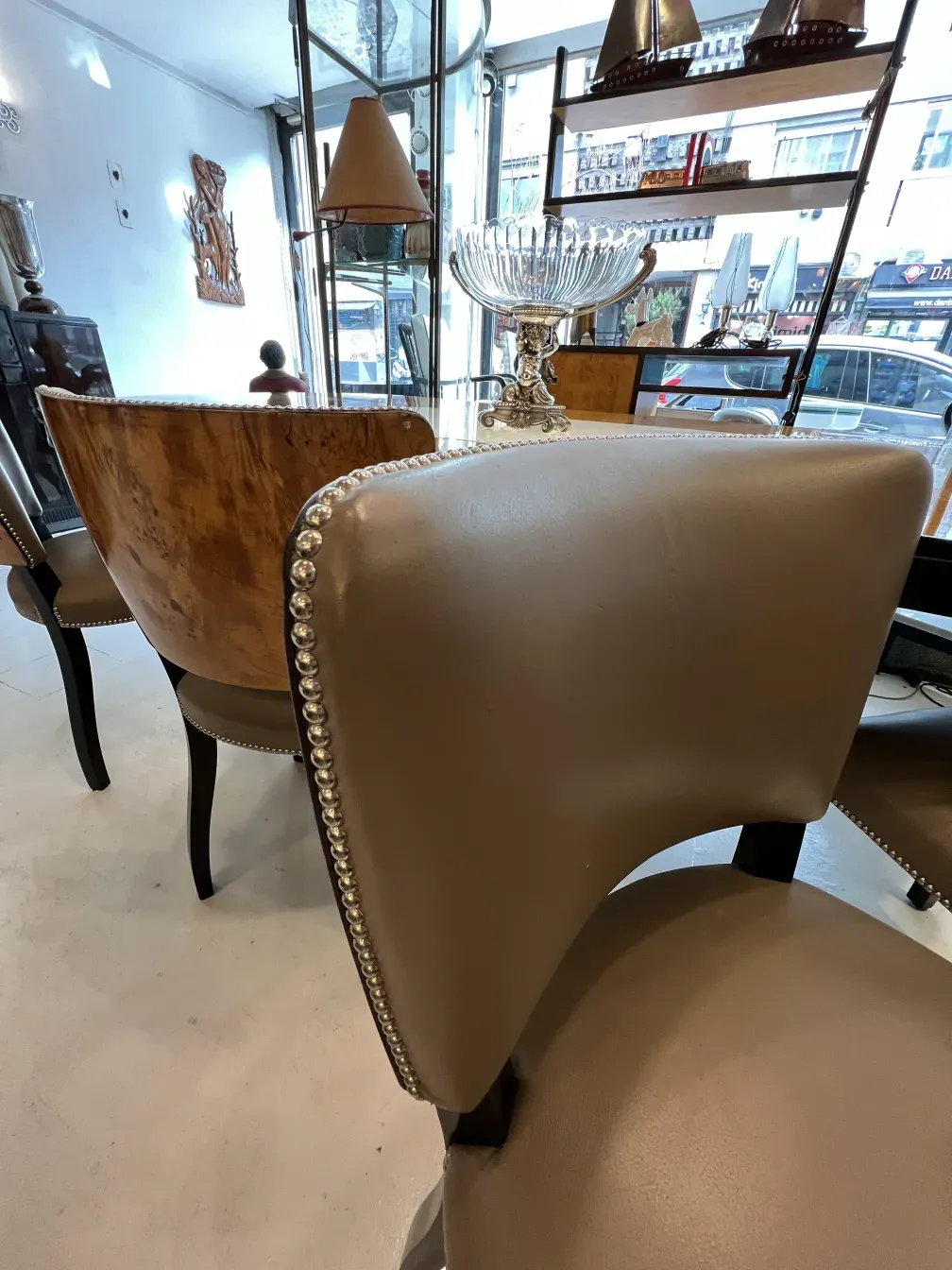 Side view of 12 antique chairs with decorative details in a cozy setting