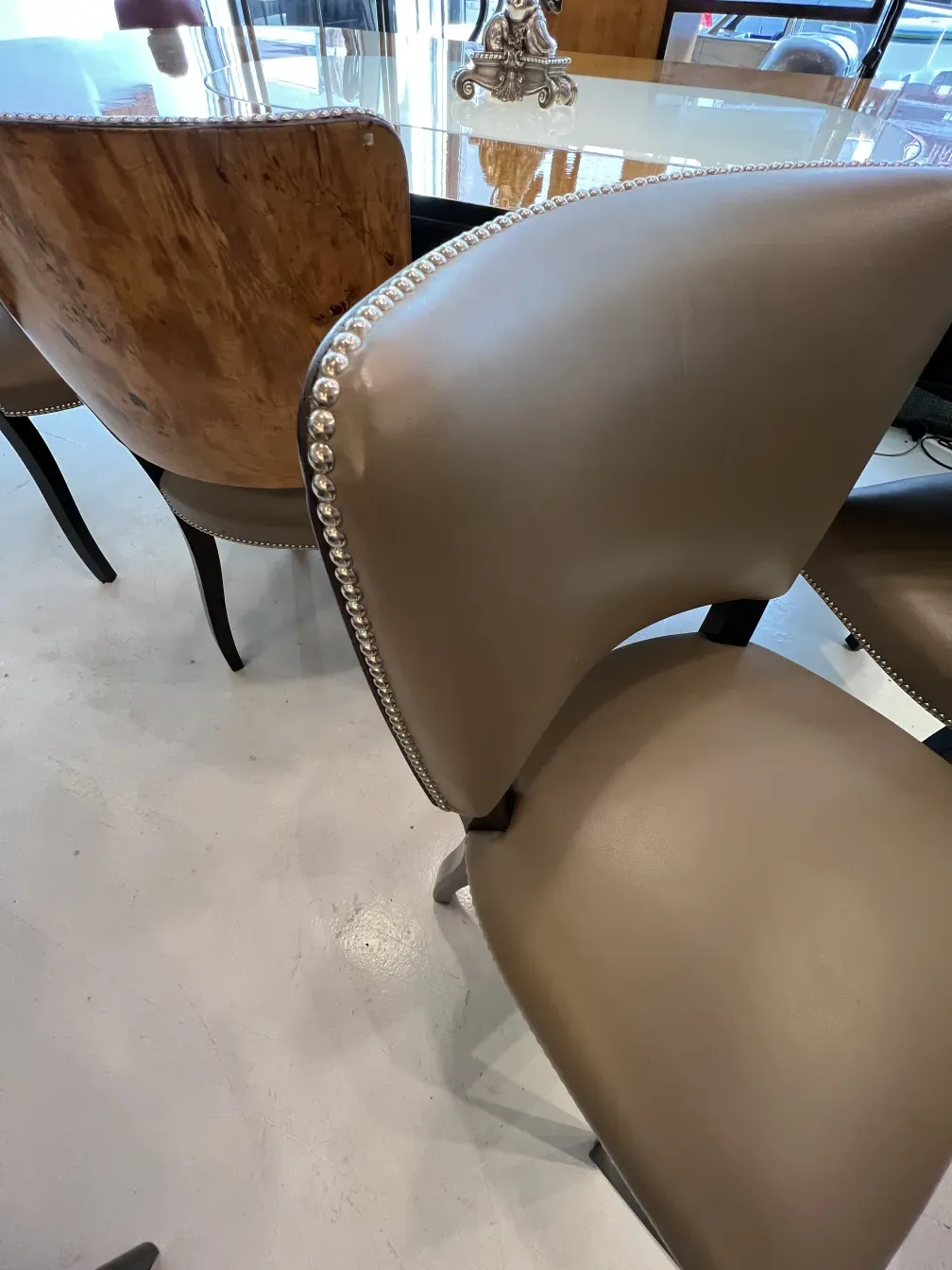 detail of antique chairs with decorative edges and a warm ambiance