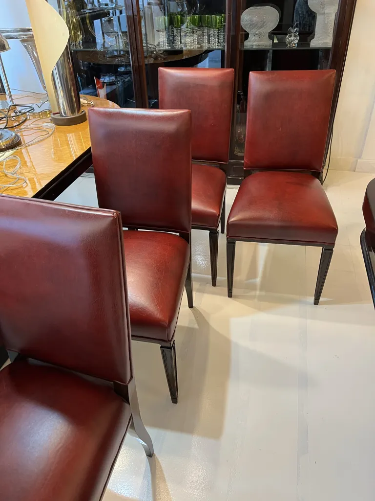 Set of 12 antique chairs with classic design in an elegant setting.