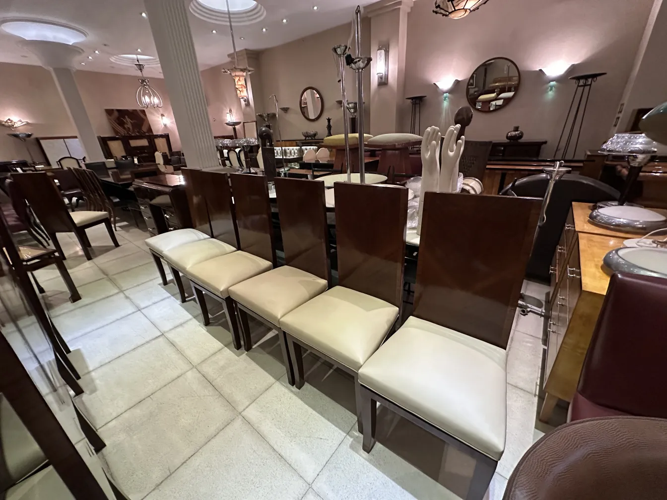 Set of 12 antique dining chairs in a room