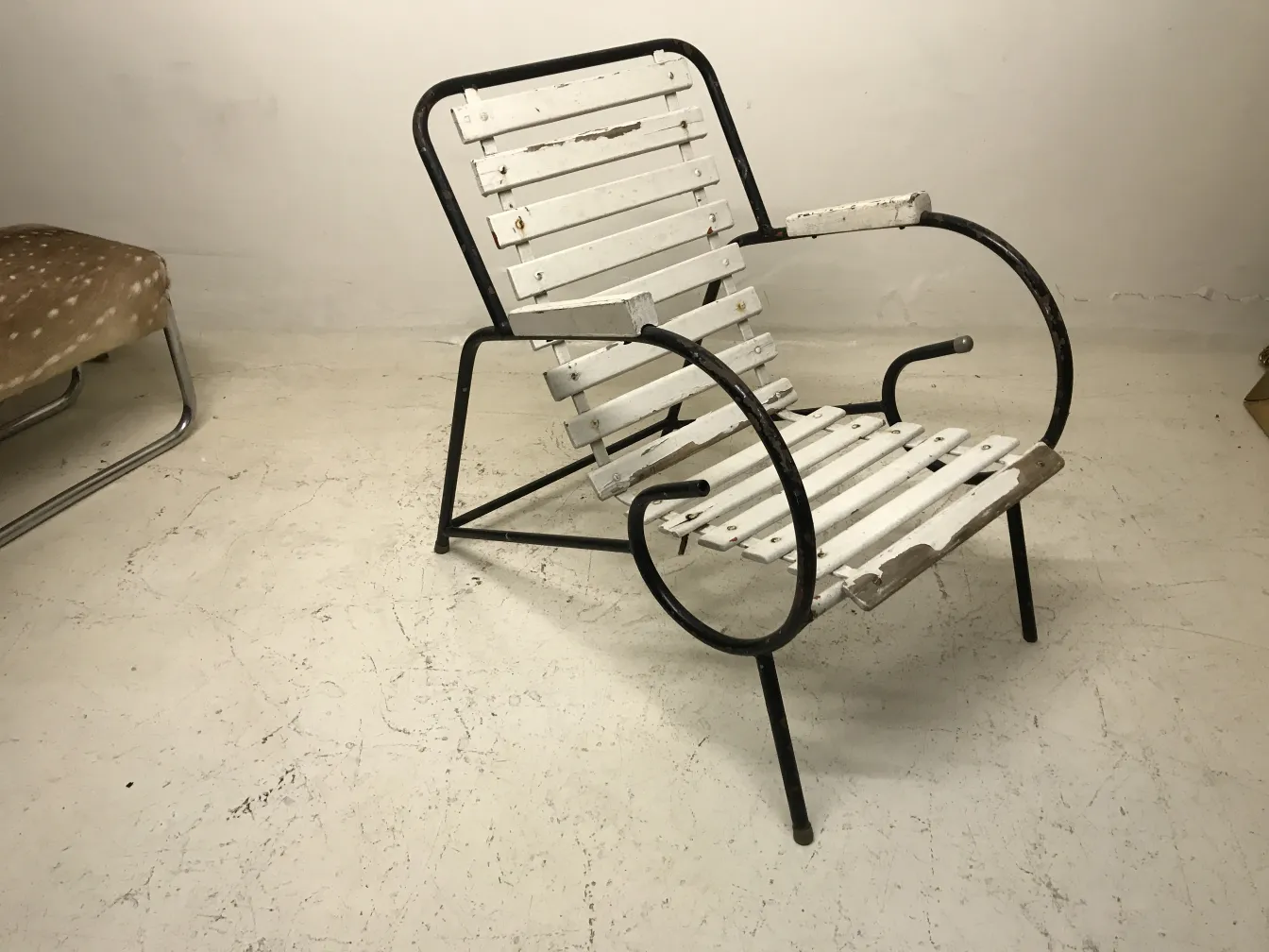 Antique garden armchairs with simple design in neutral setting