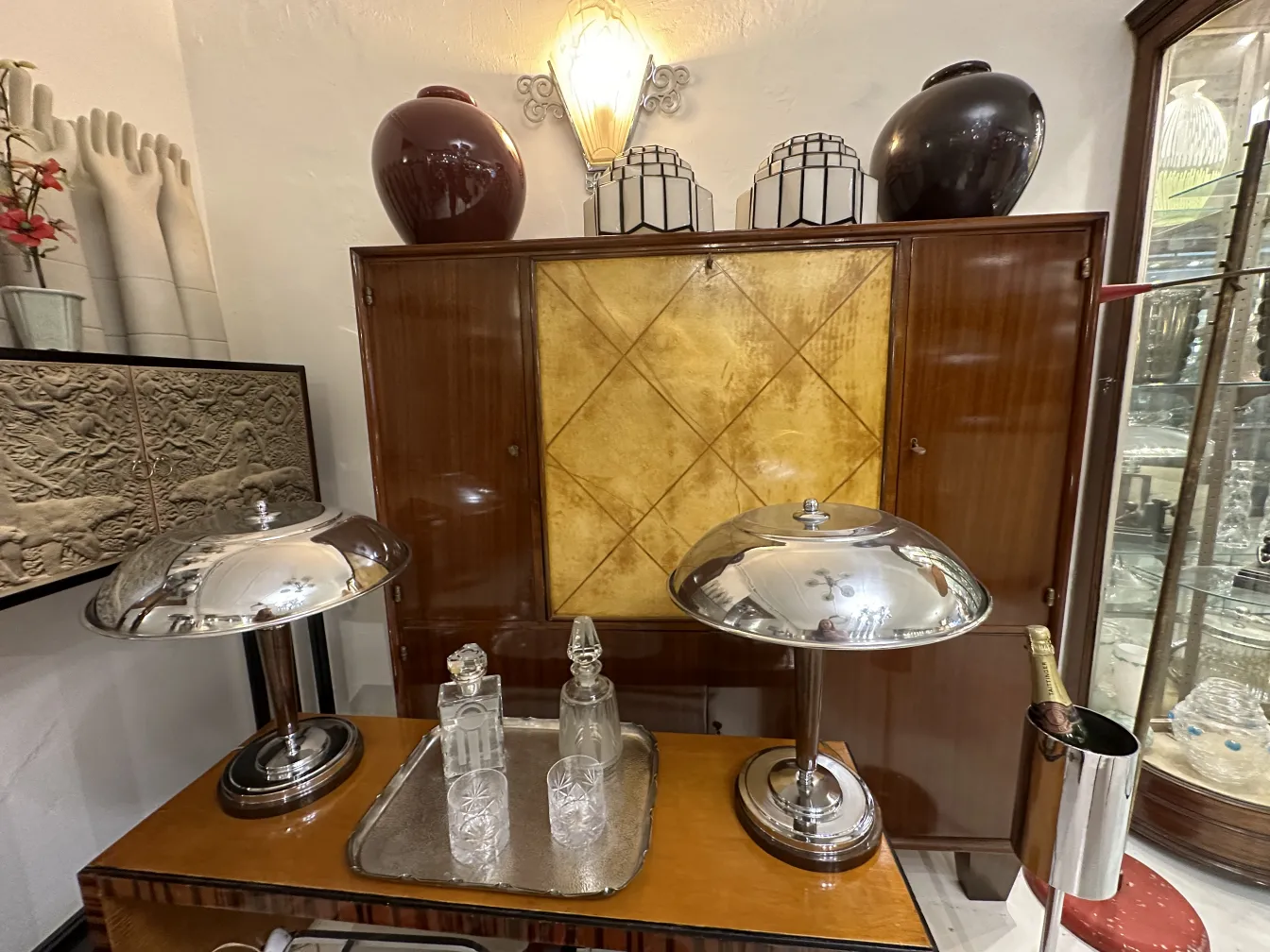 antique silver tray with striking decorations and glass bottles
