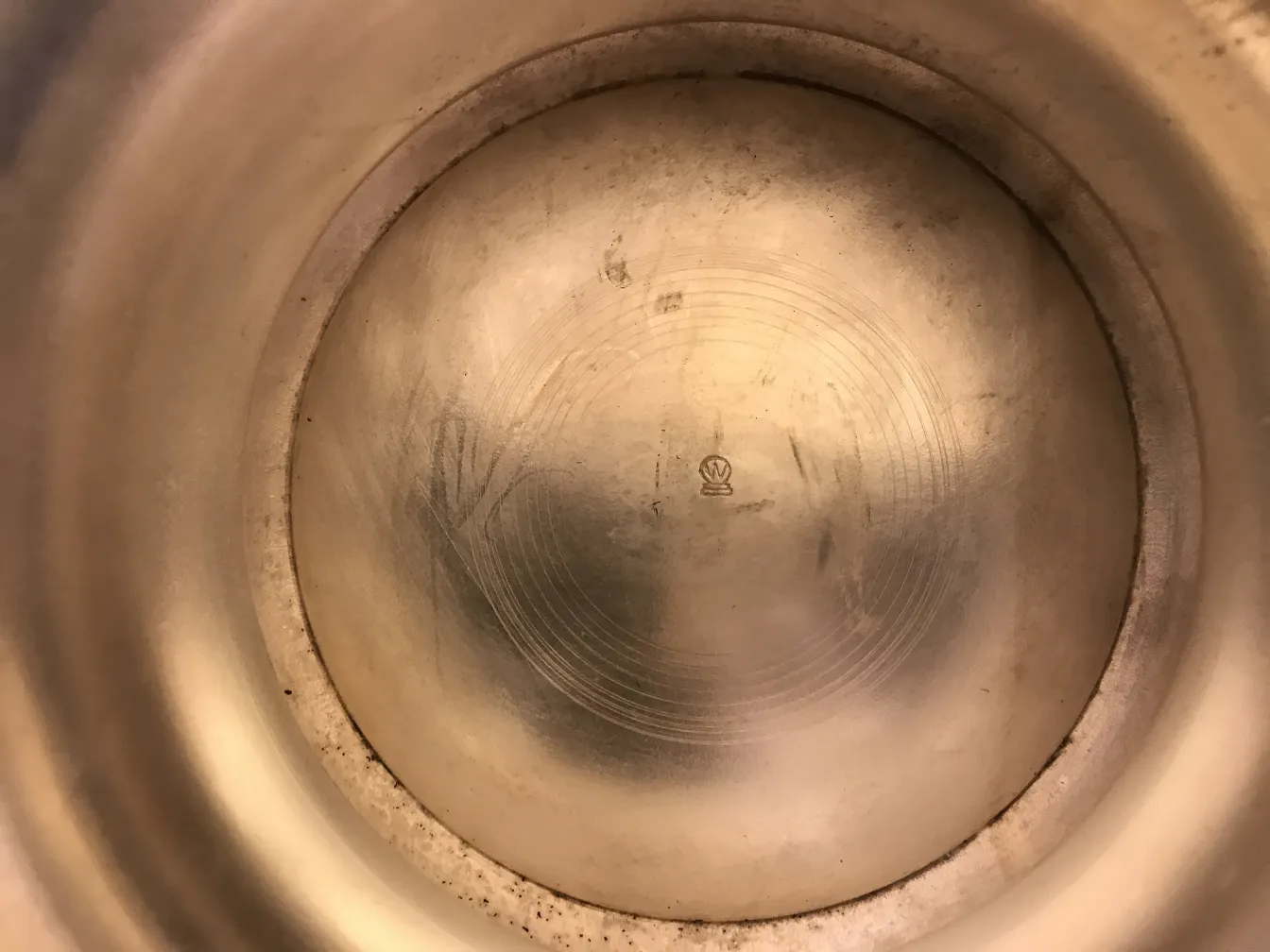 Interior of an antique umbrella stand by Kayser, no visible details.