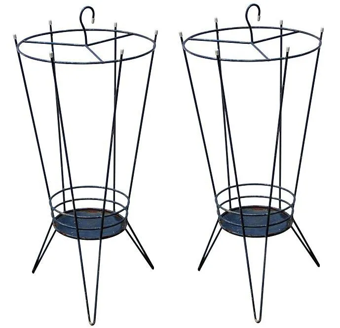 Two antique umbrella stands with elegant design in cozy setting