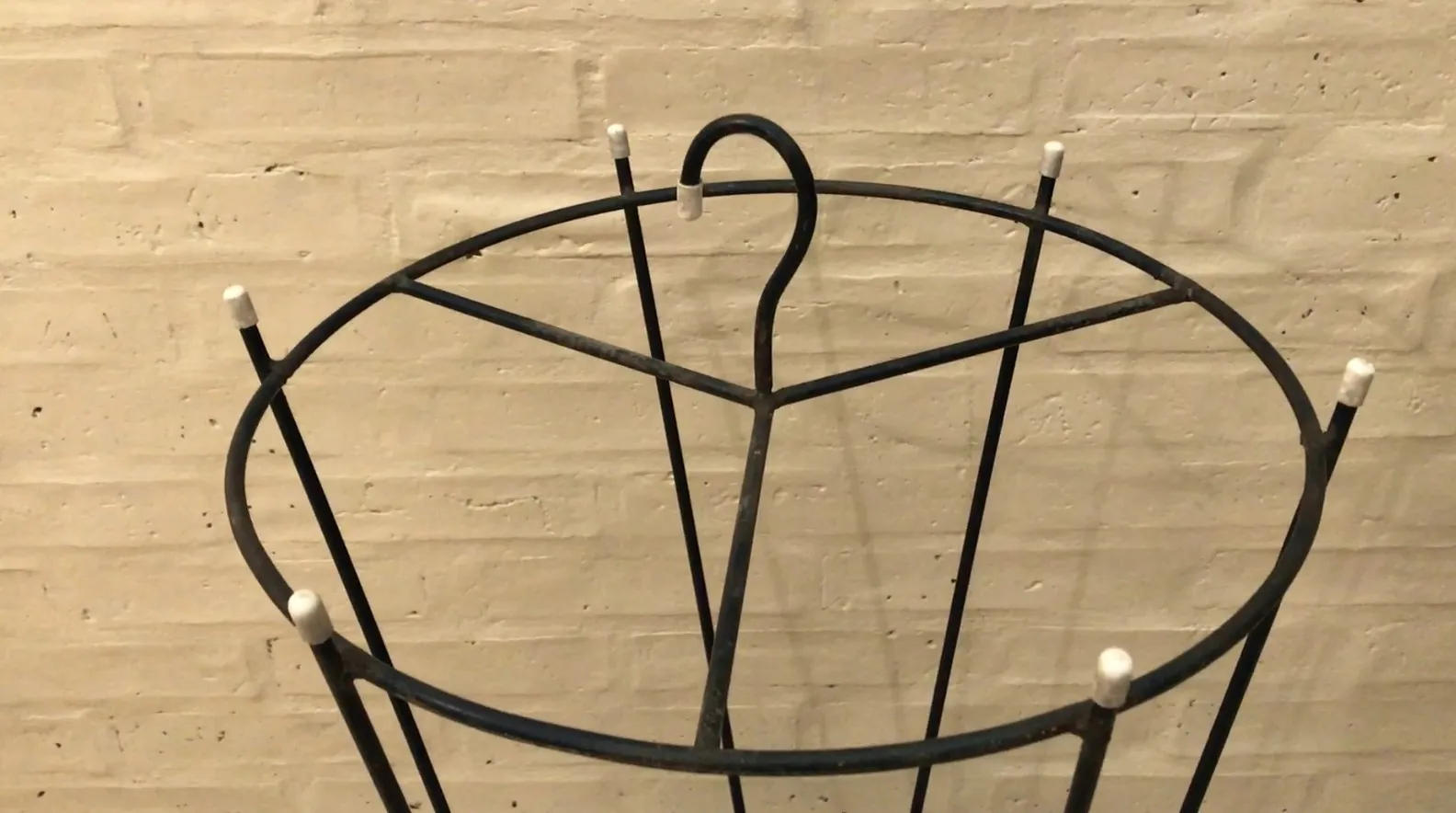 2 antique umbrella stands, decorative with unique design, light background