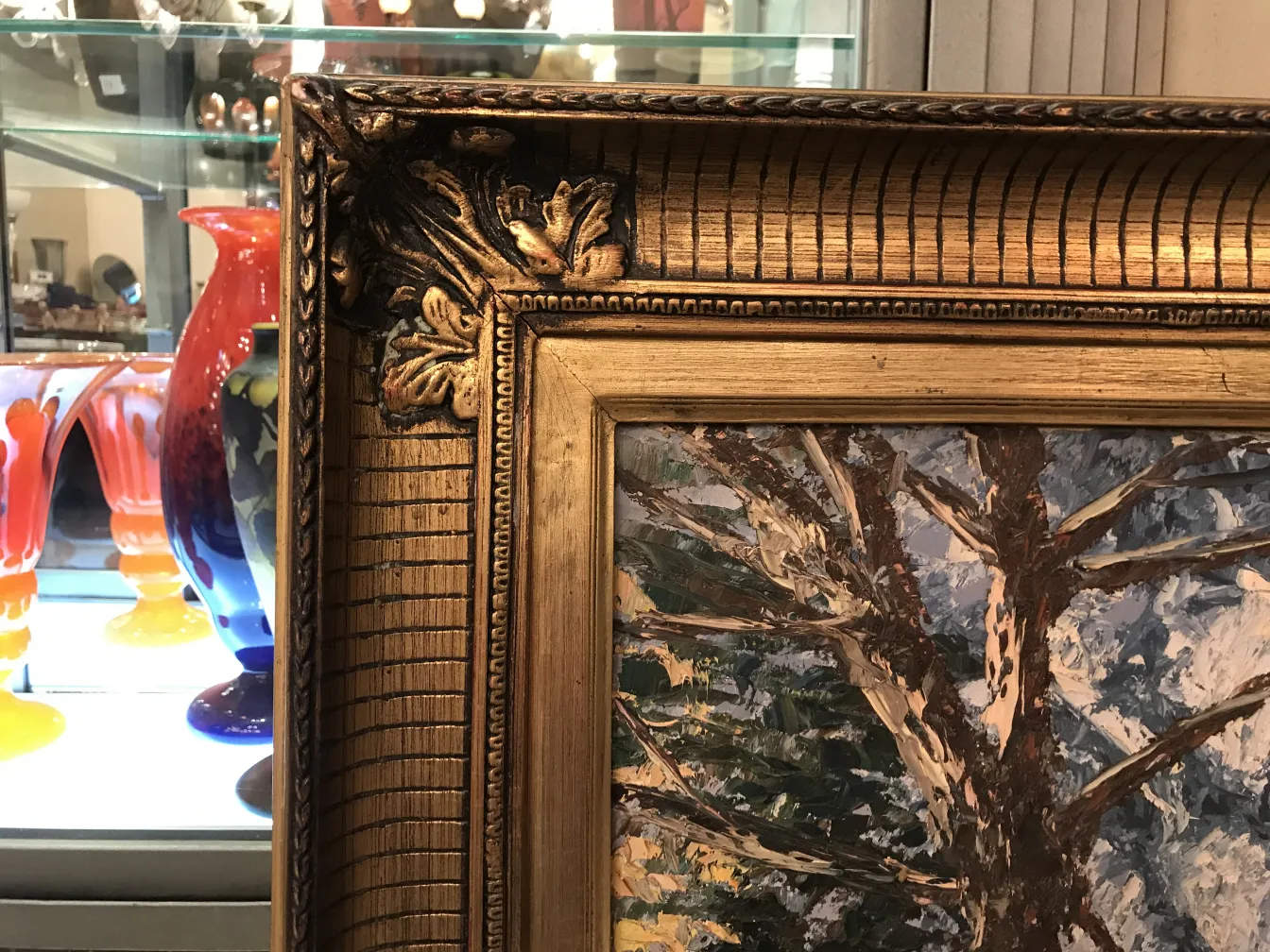 Crispino painting in a decorative gold frame in the gallery