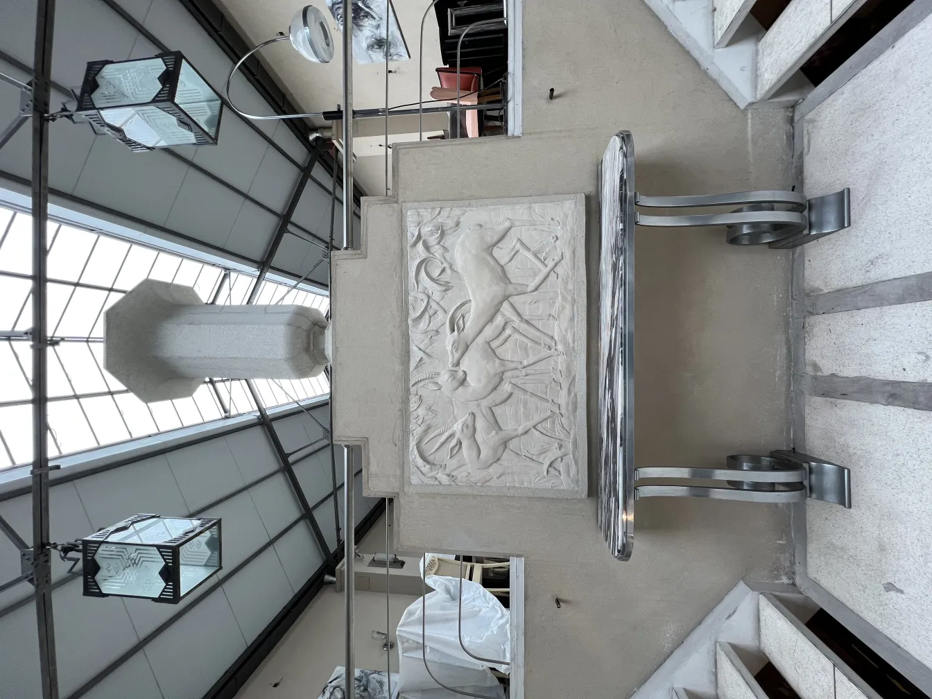 antique wall plate with reliefs in a modern space