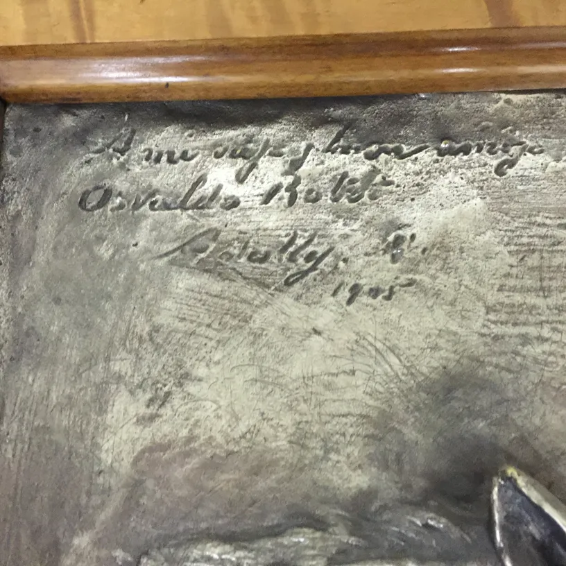 Antique wall plate featuring visible inscription and unique details