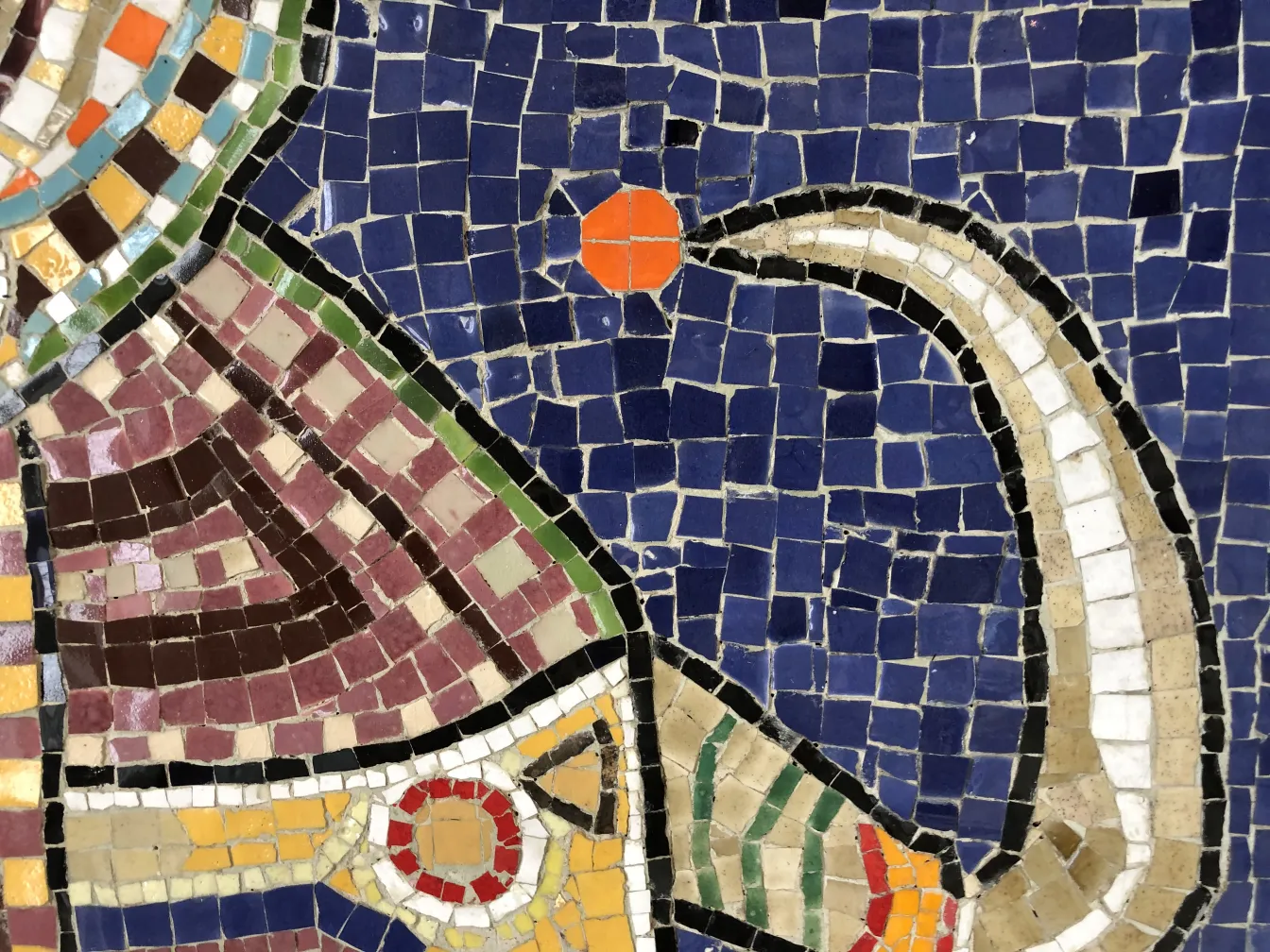Antique mosaic panel with vibrant colors and abstract shapes.