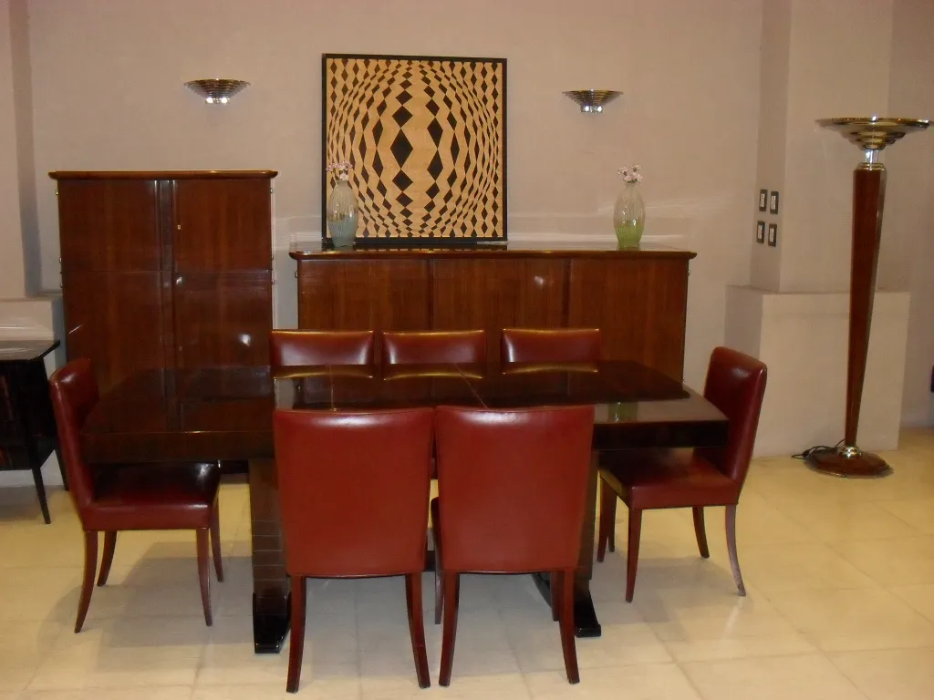 dining table with antique marquetry and red chairs