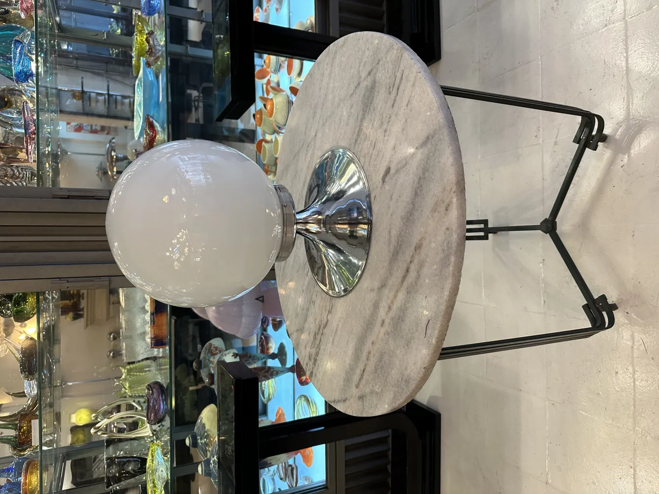 antique table lamps with shiny bases, surrounded by decorative items