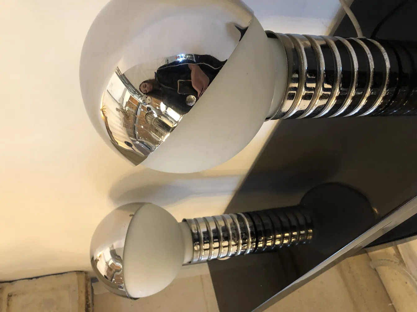 two antique table lamps with sleek design in a minimalist setting.