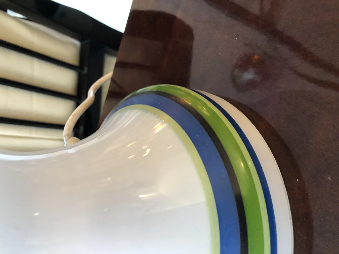 close-up of 2 antique table lamps with vibrant colors and modern surroundings