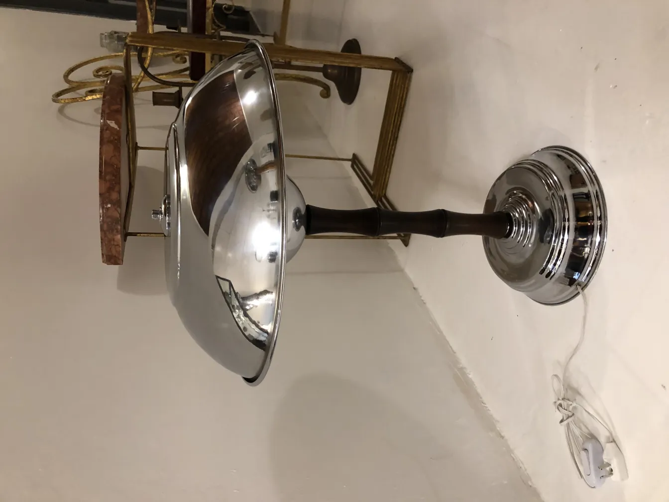 Two antique table lamps with a shiny, elegant design in a decorative setting.