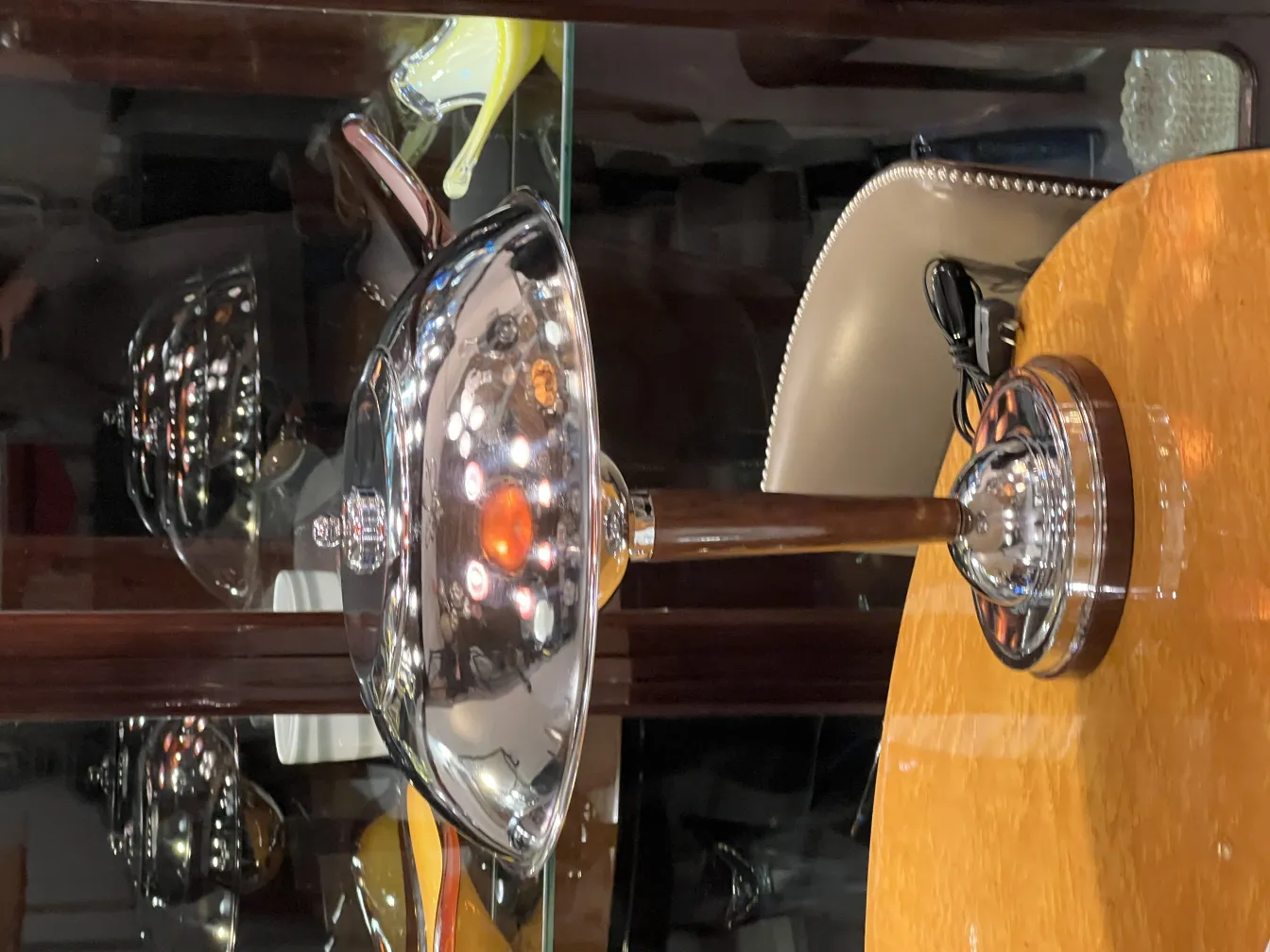 two antique table lamps with a shiny surface