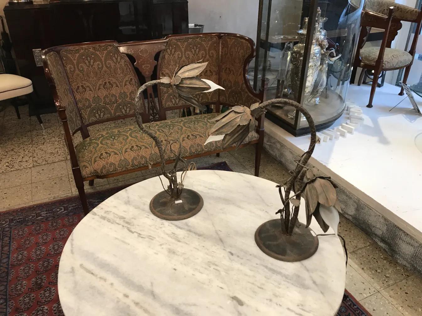 two antique table lamps shaped like flowers in a classic setting