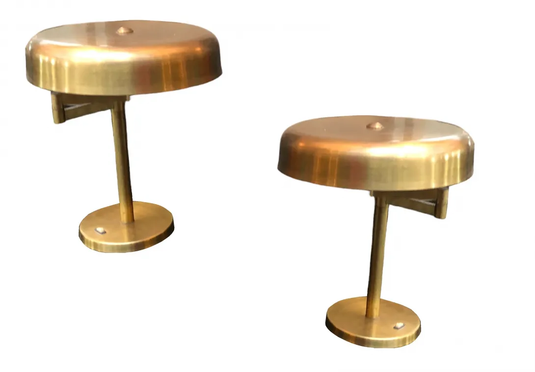 two antique table lamps with round base and circular shade in gold.