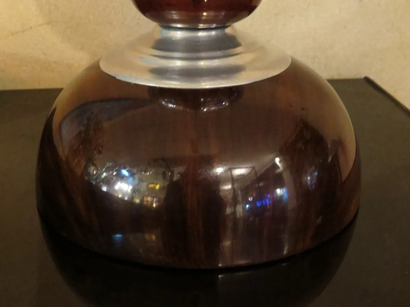 2 antique table lamps with elegant design in cozy setting.