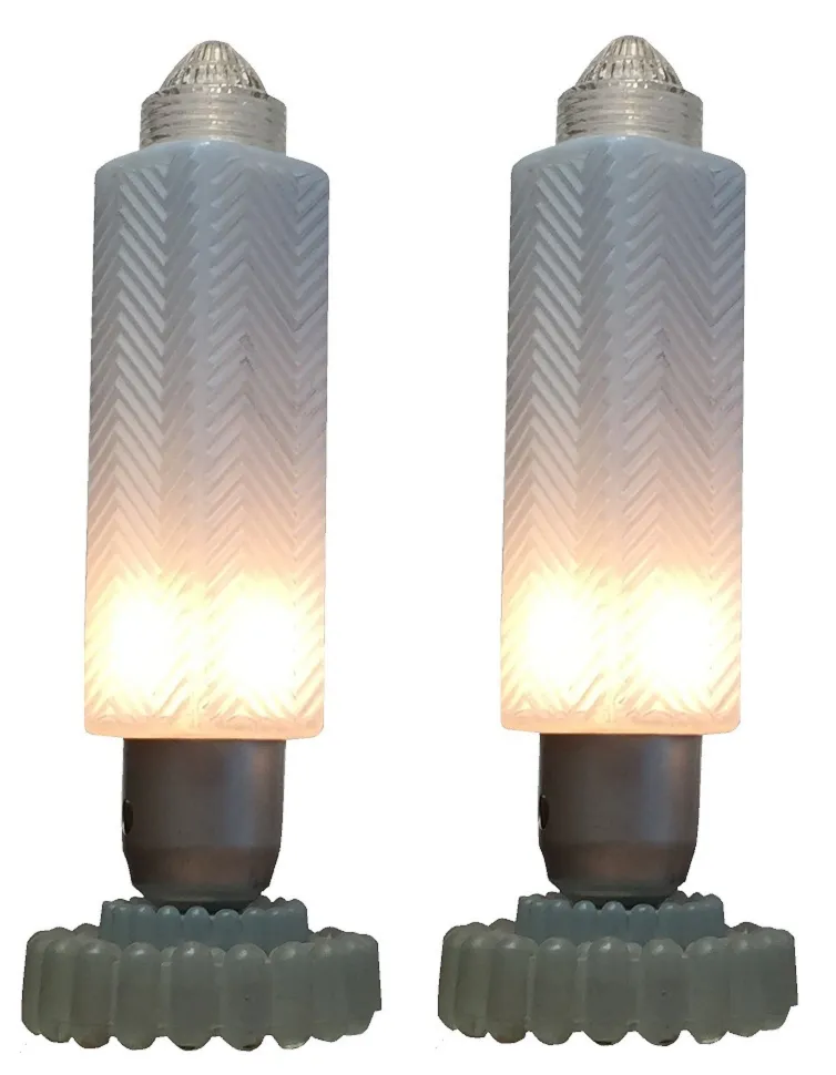 2 antique table lamps with soft light and decorative base, cozy ambiance