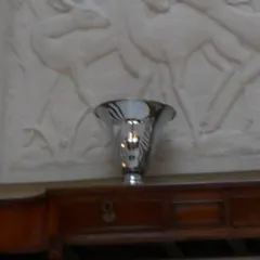 2 antique table lamps on a wooden surface