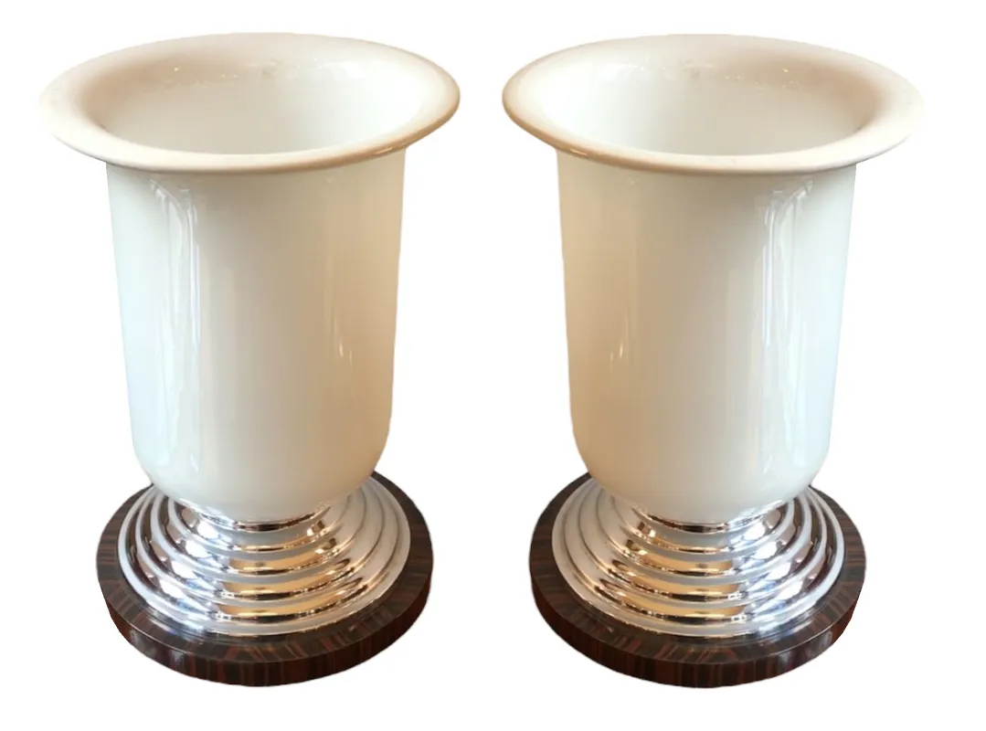 Set of 2 antique table lamps with white and silver decorative bases. Elegant setting.
