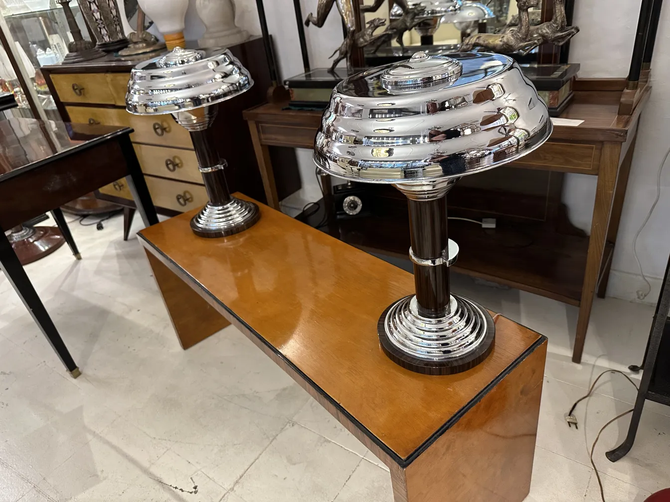 two antique table lamps with shiny elegance, on a wooden table