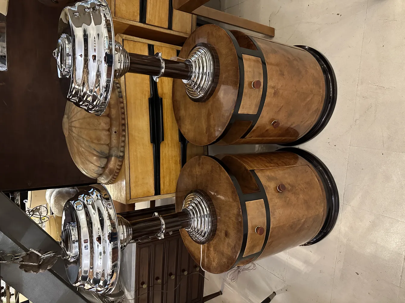 Two antique table lamps, elegant with distinctive design, in a cozy environment.