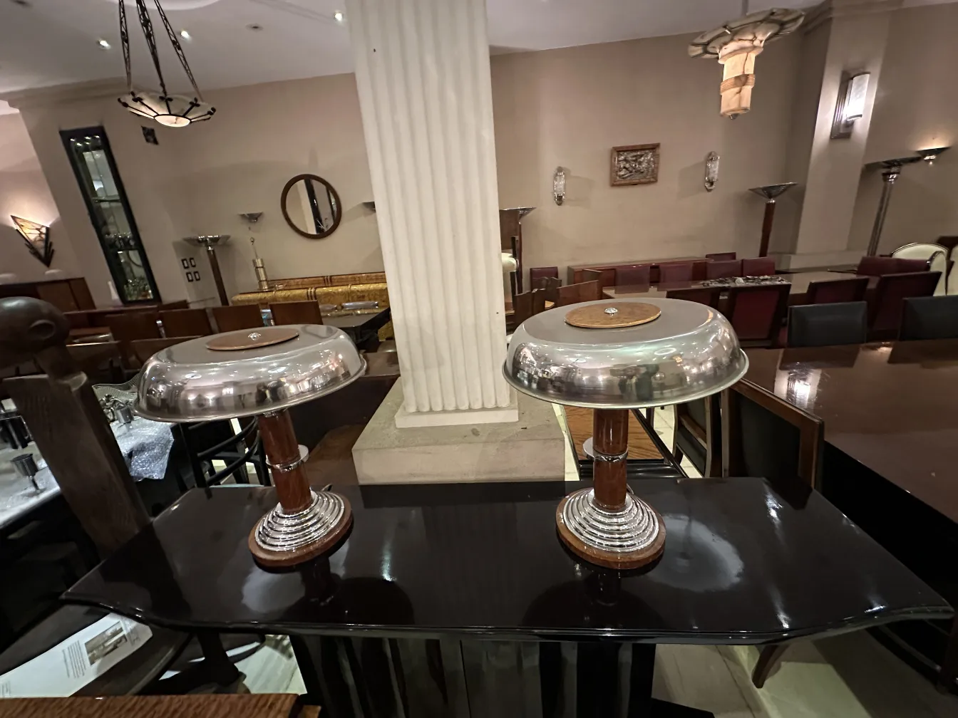 two antique table lamps in an elegant setting