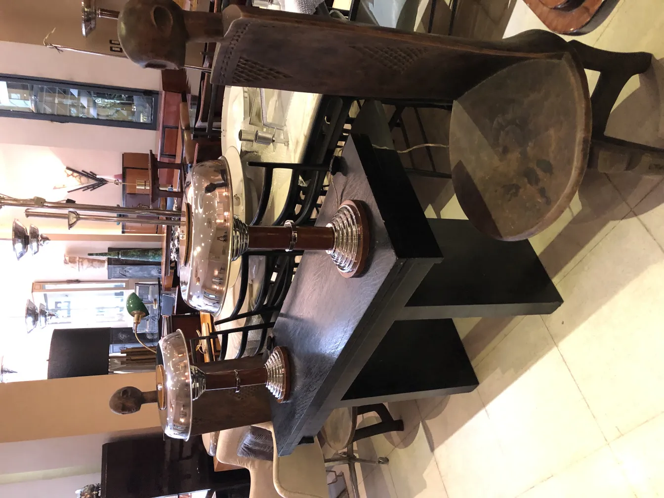 2 antique table lamps with elegant base and classic design in a cozy setting.