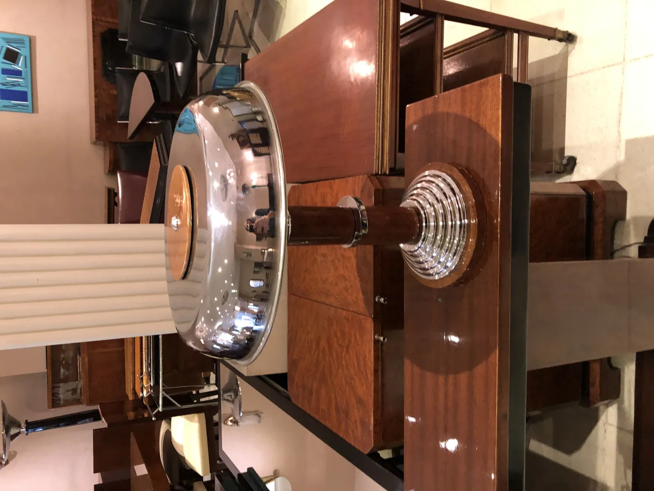 side view of 2 antique table lamps, with decorative base and shiny shade