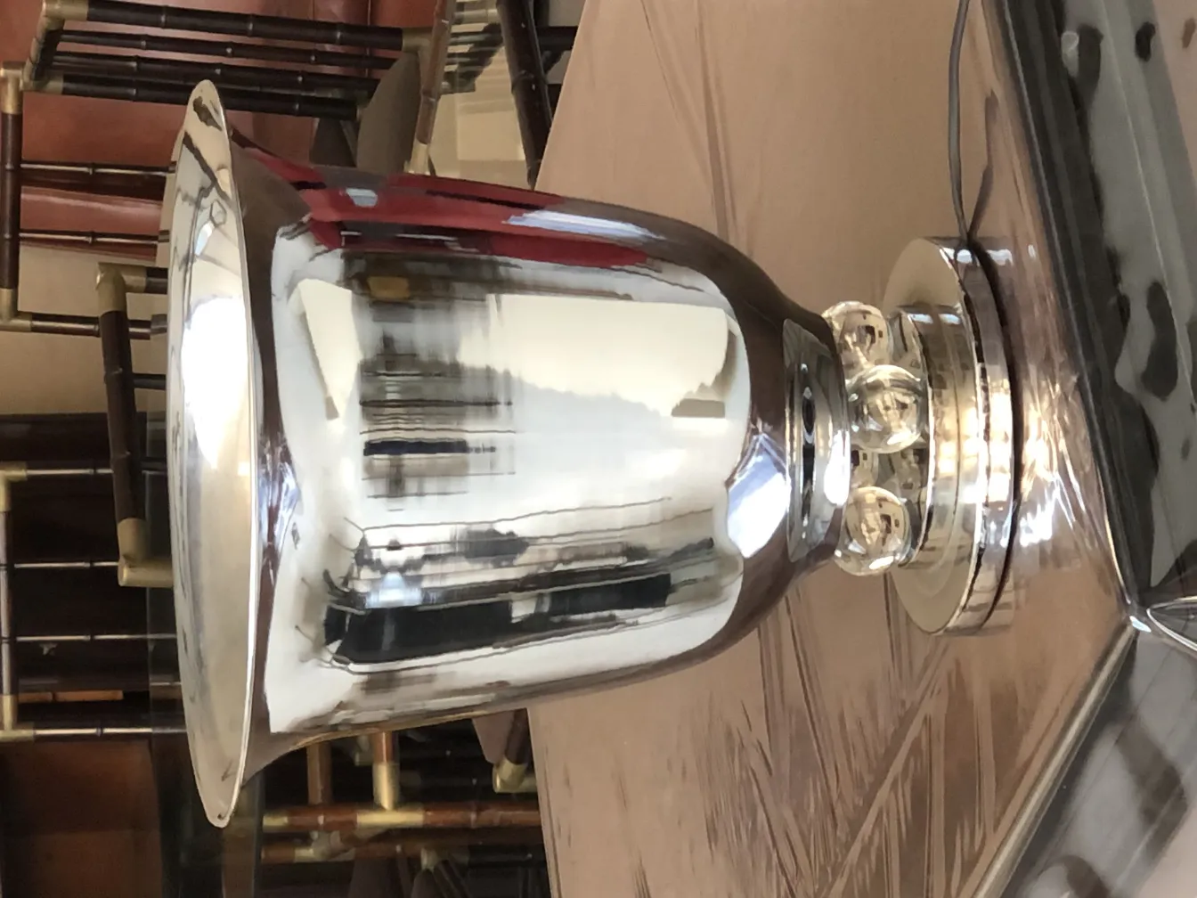 Set of 2 antique table lamps shining in a classic setting.