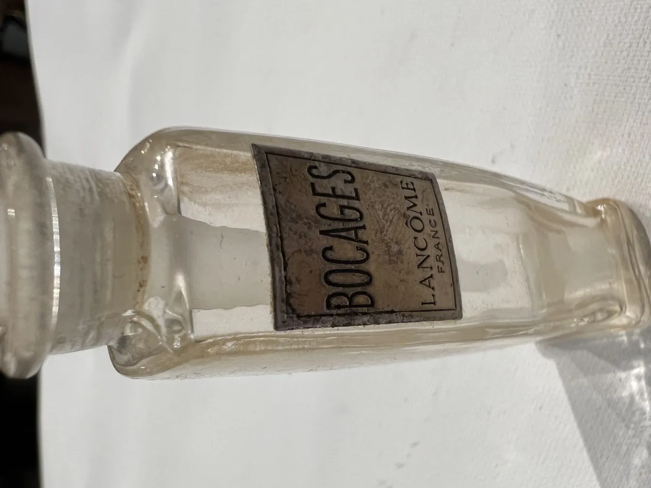 Antique Lancome perfume bottle with classic label.