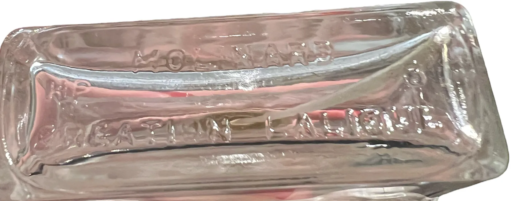 Flacone di profumo antico con dettagli incisi in alto