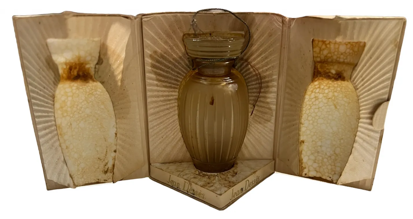 antique perfume bottle in a box with detailed design