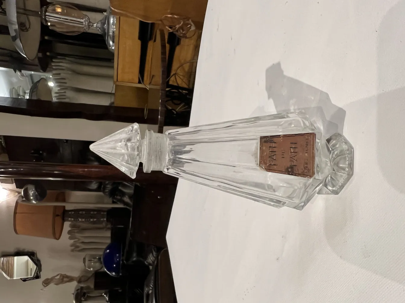 clear antique perfume bottle in a soft environment