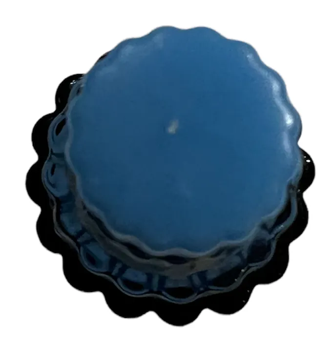 antique blue perfume bottle with wavy edge