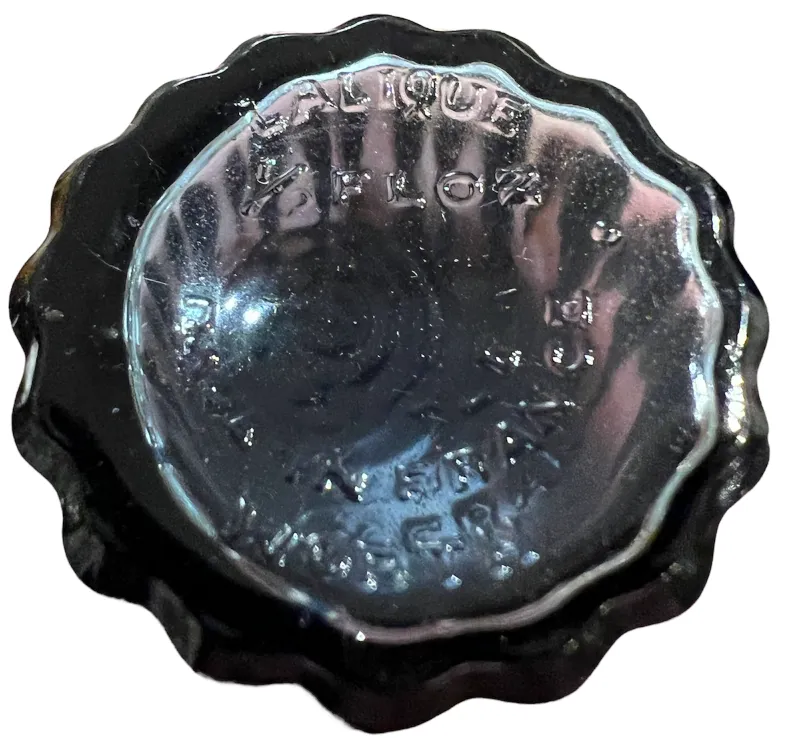 Antique perfume bottle with decorative lid design