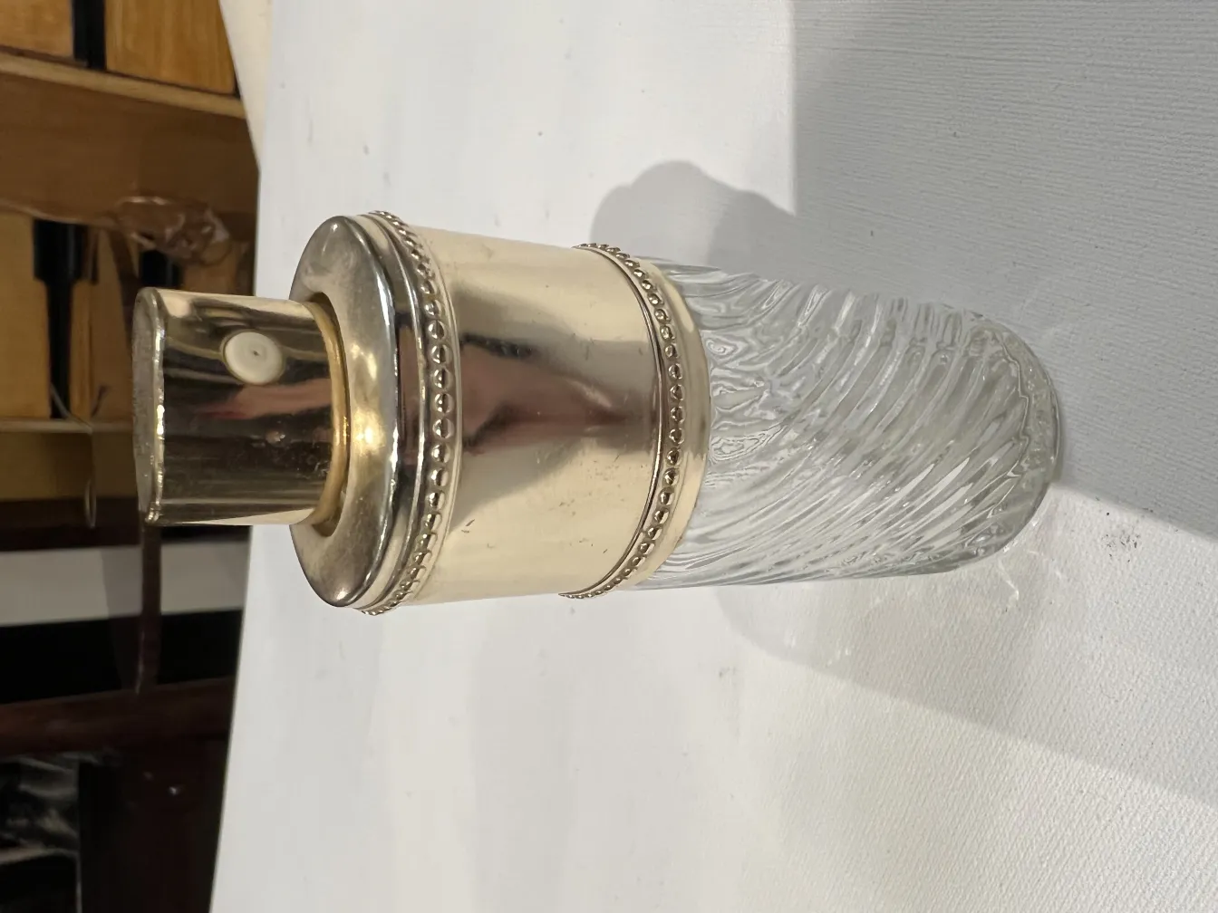 antique perfume bottle with decorative golden cap