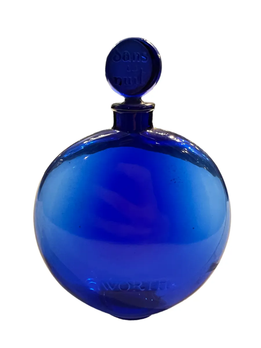 Antique blue spherical perfume bottle, clear design, elegant appearance on white background.