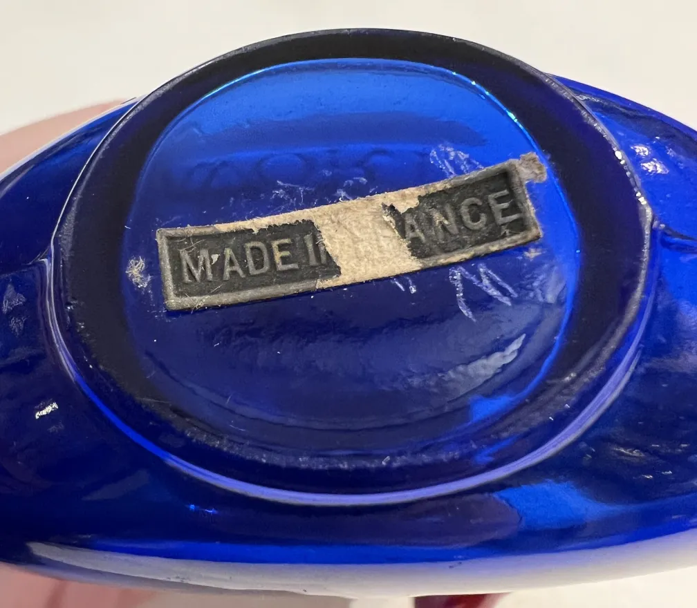 antique blue perfume bottle with removed label
